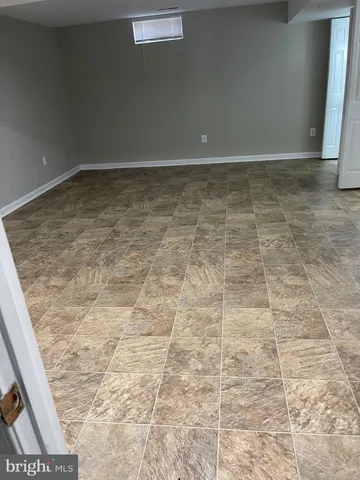 a white toilet sitting next to a bathroom sink