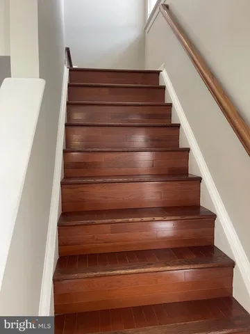 a view of hallway with wooden floor
