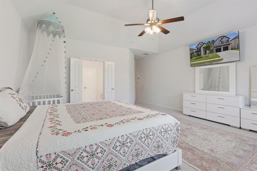 Undisclosed Address Wylie, TX 75098 - Photo 14 of 26 Bedroom with ceiling fan and lofted ceiling