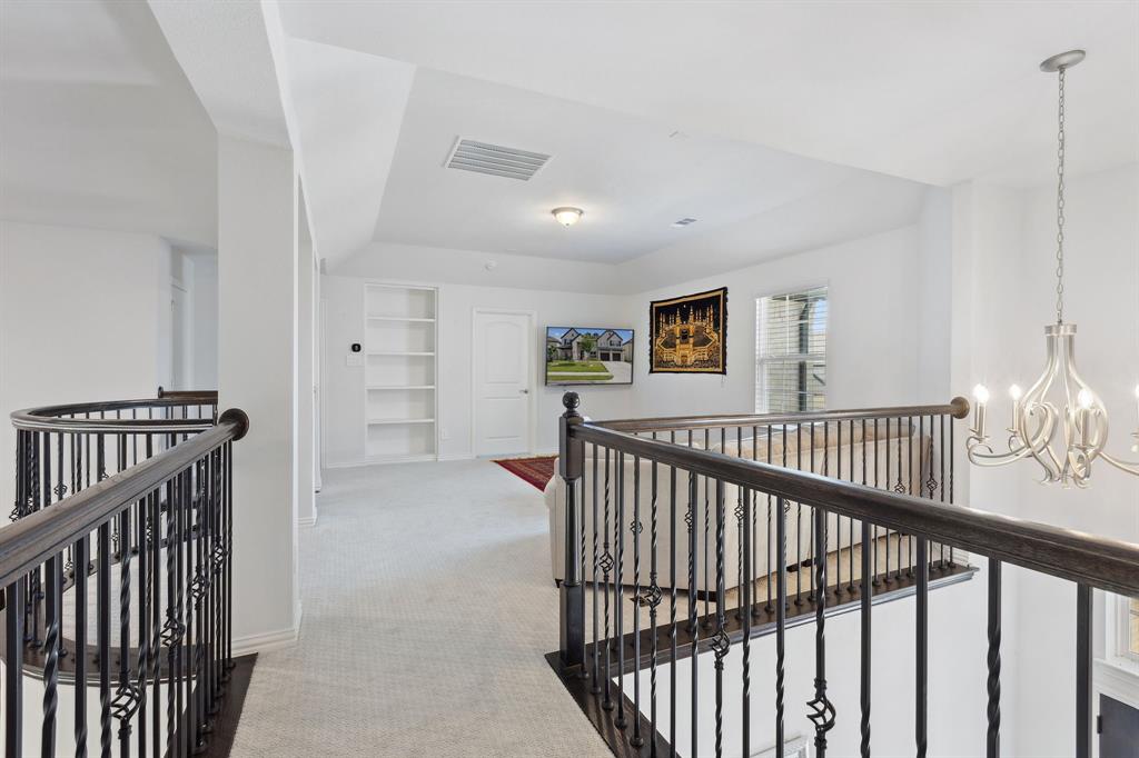 Undisclosed Address Wylie, TX 75098 - Photo 17 of 26 Hall with an upstairs landing, a chandelier