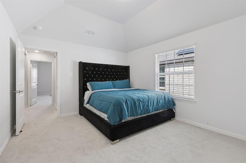 Undisclosed Address Wylie, TX 75098 - Photo 23 of 26 Bedroom with vaulted ceiling and carpet flooring