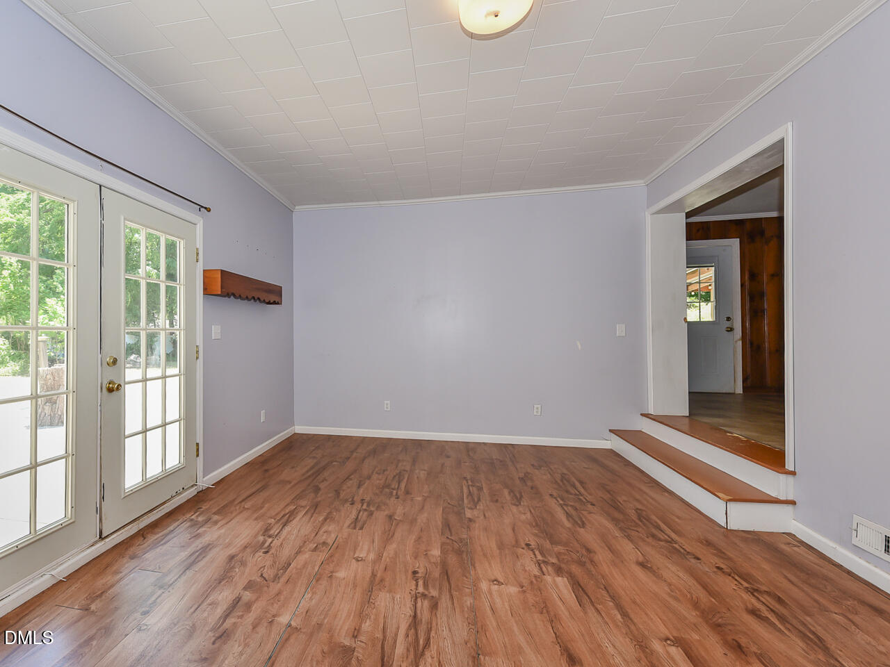 1703 St Patrick Drive Raleigh, NC 27603 - Photo 11 of 29 a view of wooden floor and windows in a room