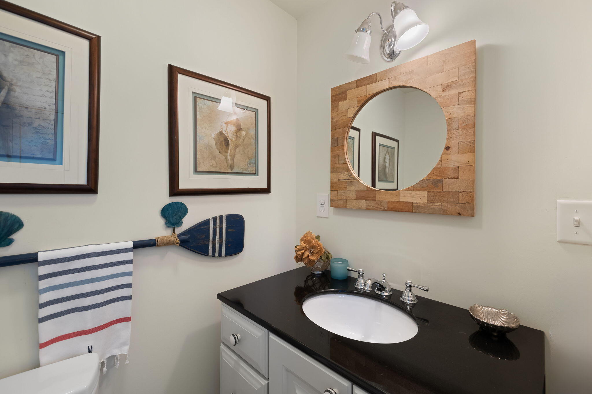 63 Briar Spring Road Orleans, MA 02653 - Photo 17 of 37 a bathroom with a sink and a mirror