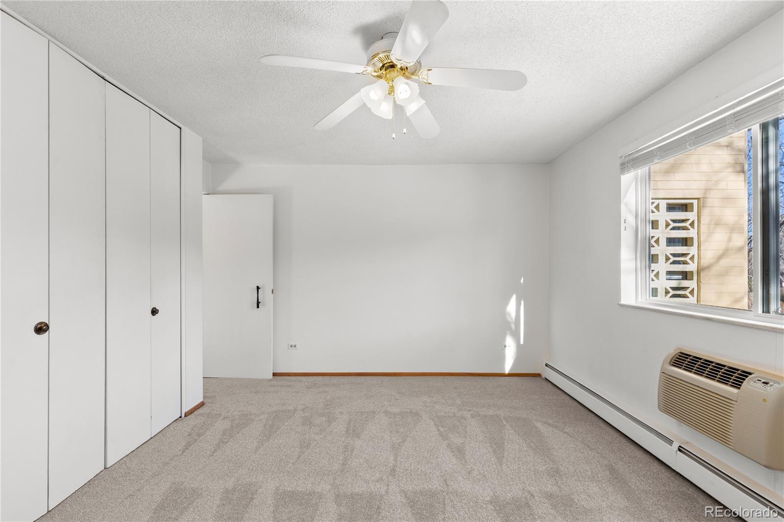 750 South Clinton Street, Unit 2B Denver, CO 80247 - Photo 17 of 43 a view of an empty room with a window