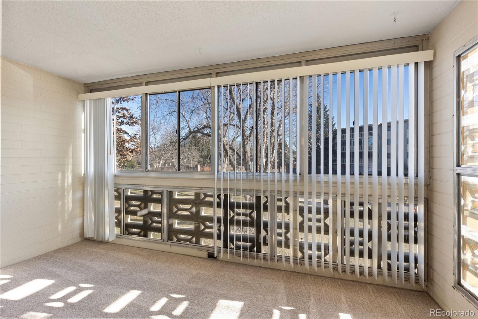 750 South Clinton Street, Unit 2B Denver, CO 80247 - Photo 21 of 43 a view of a porch with a window