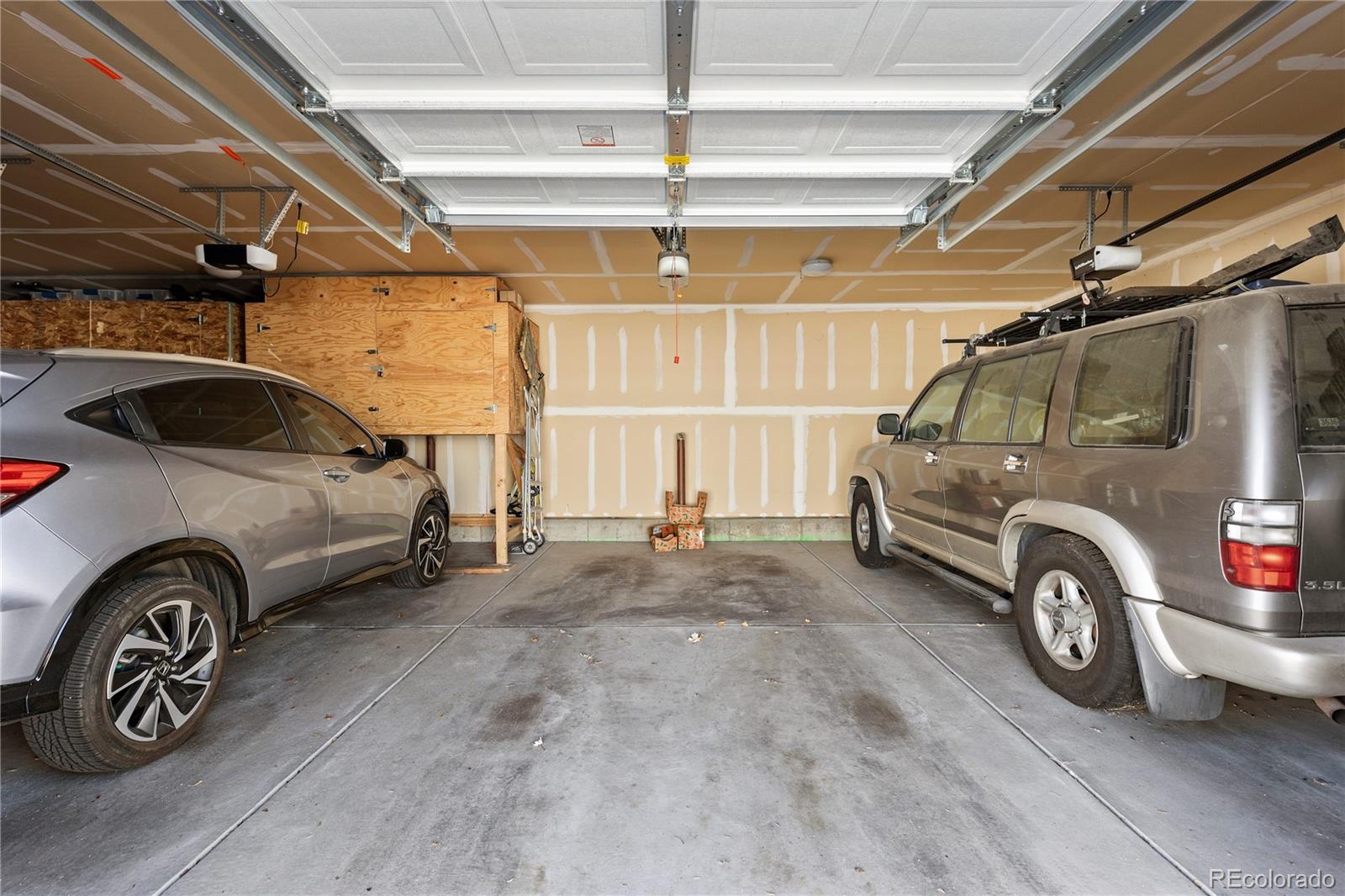 750 South Clinton Street, Unit 2B Denver, CO 80247 - Photo 28 of 43 a view of a car in garage