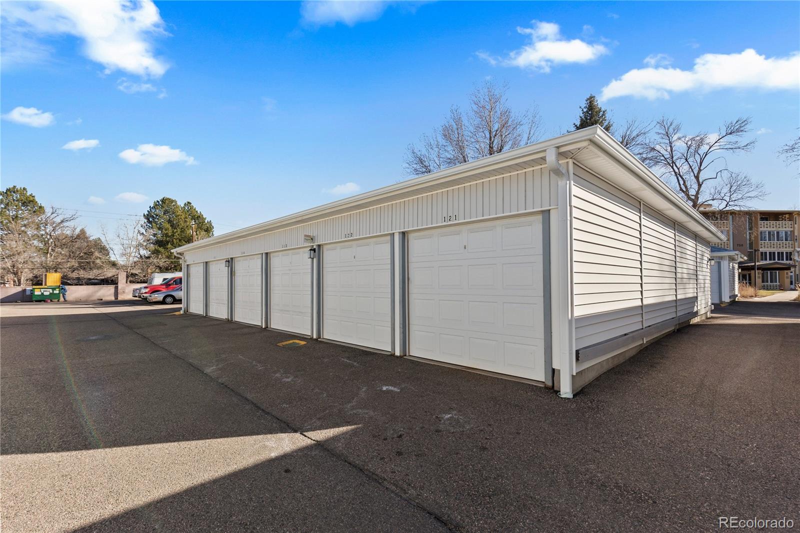 750 South Clinton Street, Unit 2B Denver, CO 80247 - Photo 29 of 43 a view of a street with a garage