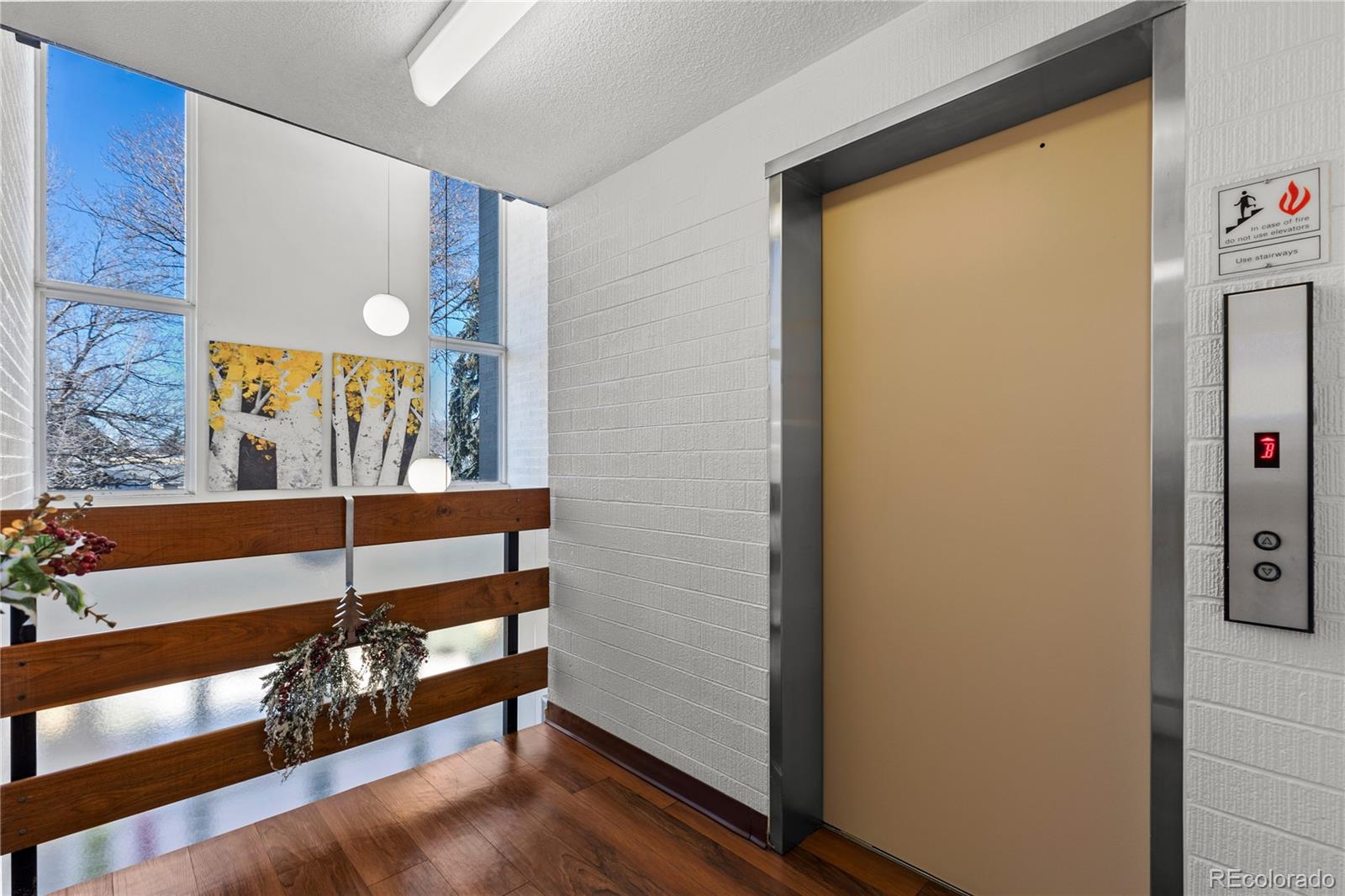 750 South Clinton Street, Unit 2B Denver, CO 80247 - Photo 35 of 43 a view of a hallway with a large window