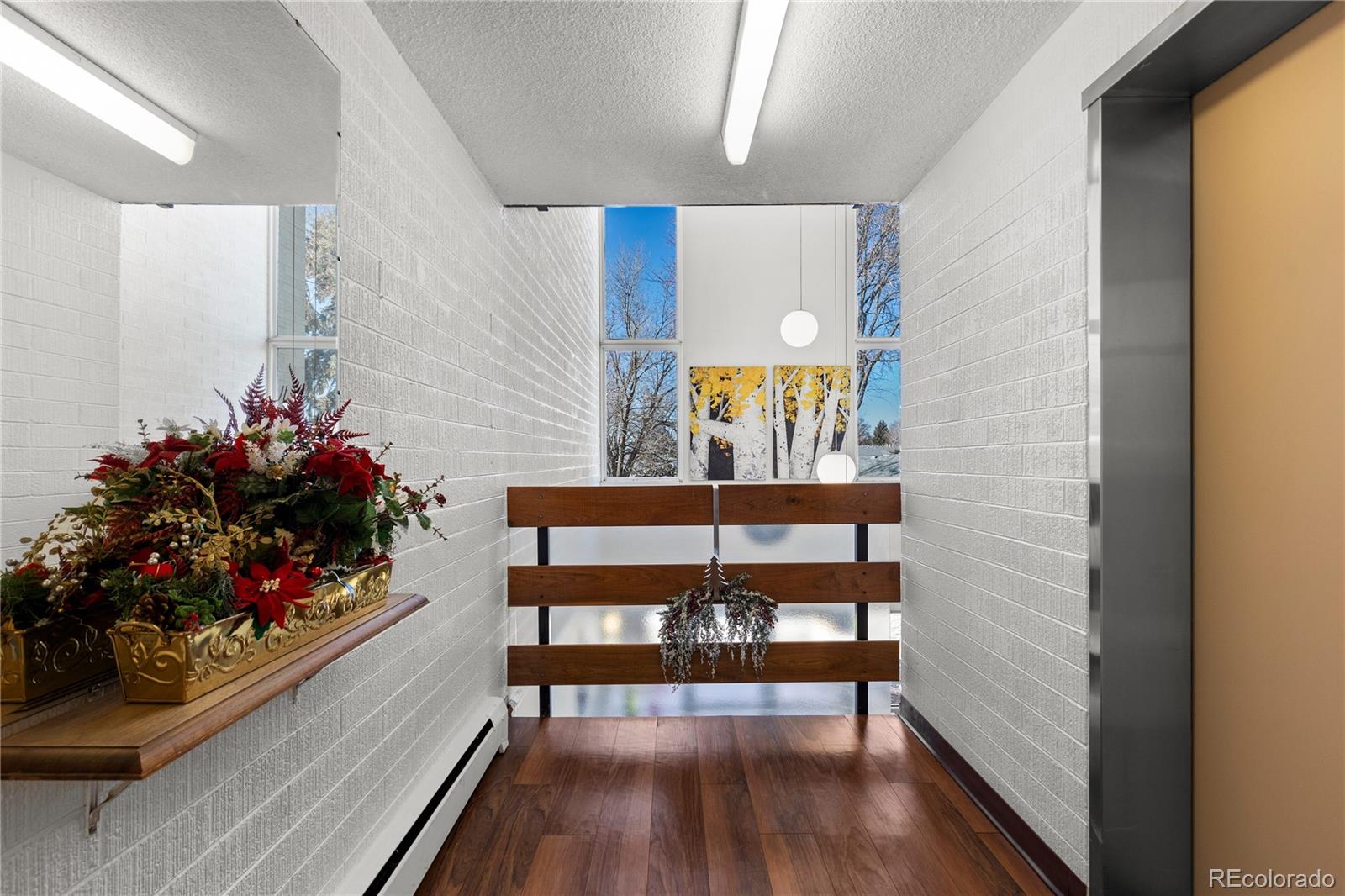 750 South Clinton Street, Unit 2B Denver, CO 80247 - Photo 36 of 43 a room with lots of flowers and wooden floor