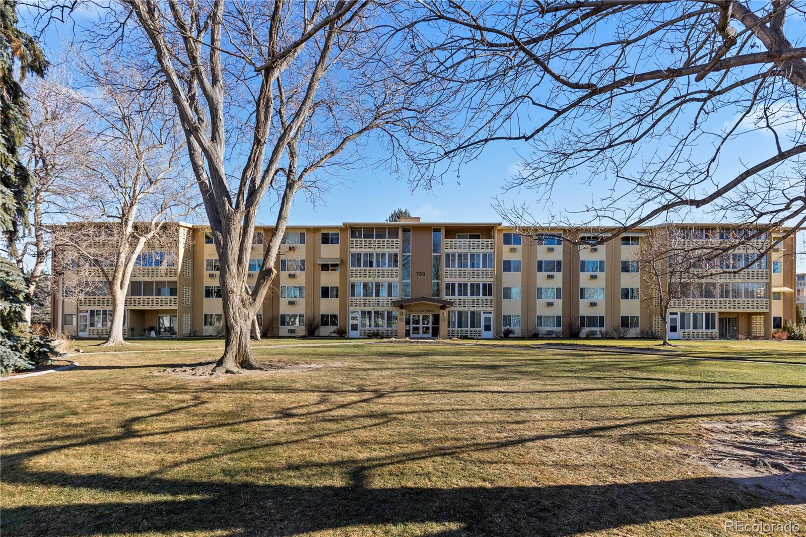 750 South Clinton Street, Unit 2B Denver, CO 80247 - Photo 39 of 43 a large building with large trees