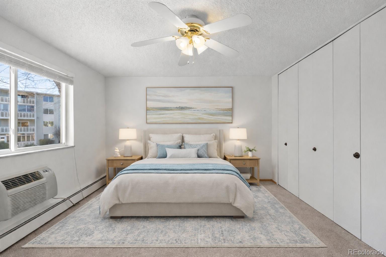750 South Clinton Street, Unit 2B Denver, CO 80247 - Photo 4 of 43 a bedroom with a bed and a chandelier