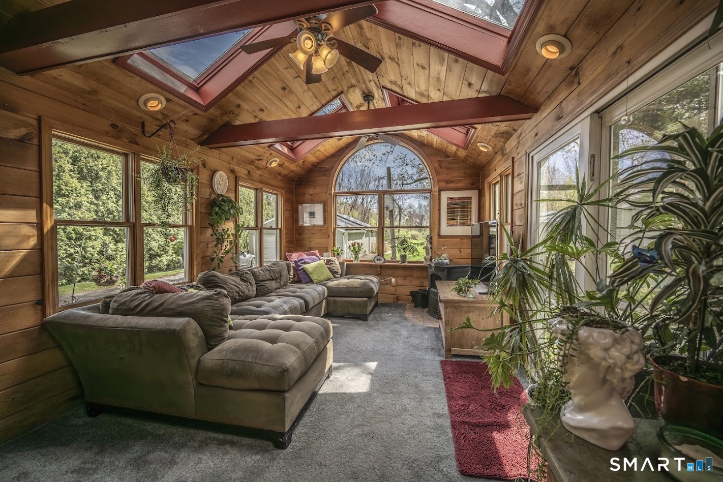 53 Cedar Street Middlefield, CT 06481 - Photo 5 of 30 Stunning sunroom retreat featuring soaring ceilings, natural wood finishes, and abundant light.