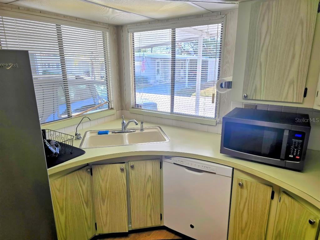 12501 Ulmerton Road, Unit 188 Largo, FL 33774 - Photo 7 of 63 a bathroom with a sink and a window