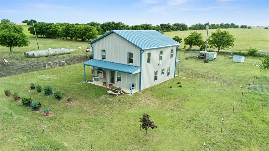 124 County Road 4511 Decatur, TX 76234 - Photo 1 of 39 a aerial view of a house with a yard table and chairs