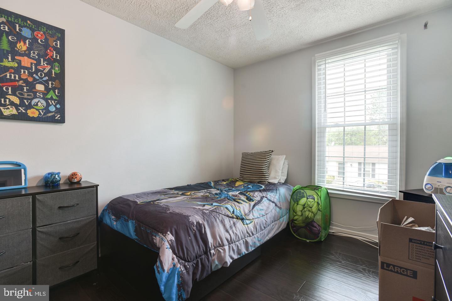 7310 Torran Rocks Way Gaithersburg, MD 20879 - Photo 16 of 32 a bedroom with a bed and a window