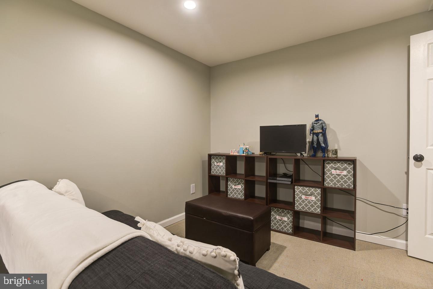 7310 Torran Rocks Way Gaithersburg, MD 20879 - Photo 21 of 32 a bedroom with a bed and a television