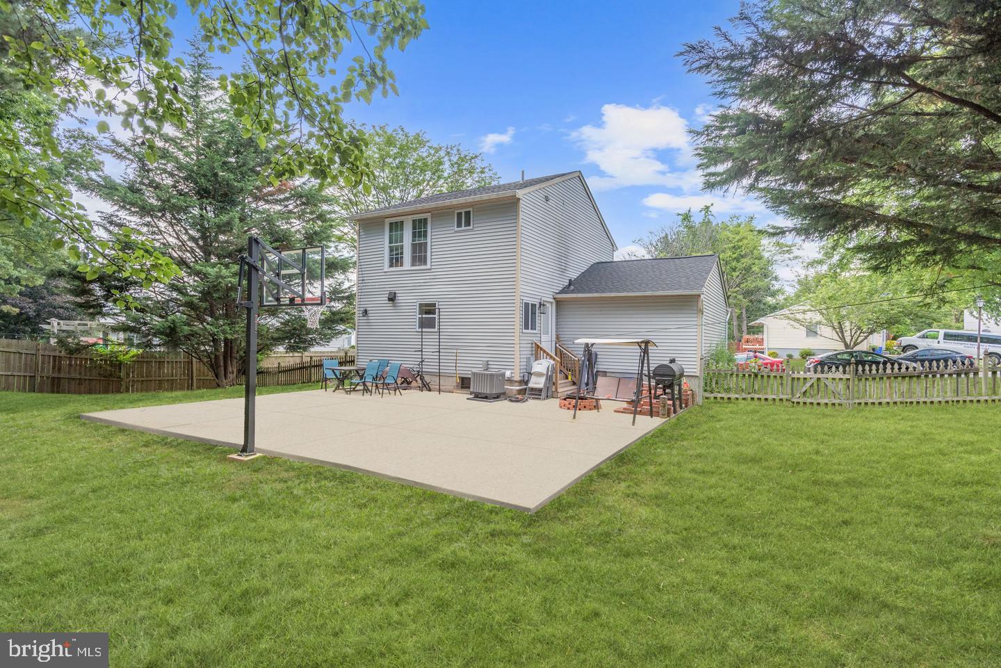 7310 Torran Rocks Way Gaithersburg, MD 20879 - Photo 25 of 32 a view of a house with backyard and sitting area
