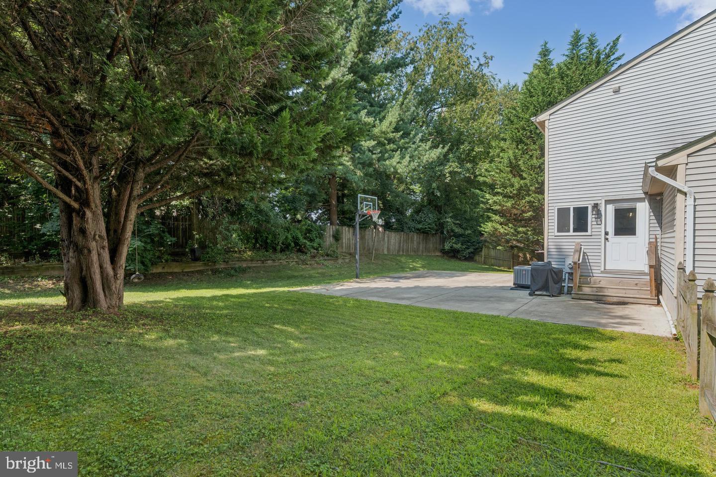 7310 Torran Rocks Way Gaithersburg, MD 20879 - Photo 27 of 32 a view of a house with a backyard