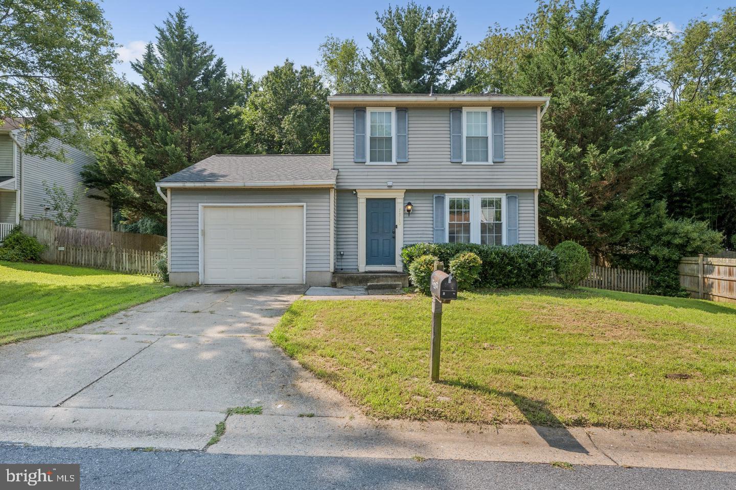 7310 Torran Rocks Way Gaithersburg, MD 20879 - Photo 32 of 32 a front view of a house with garden