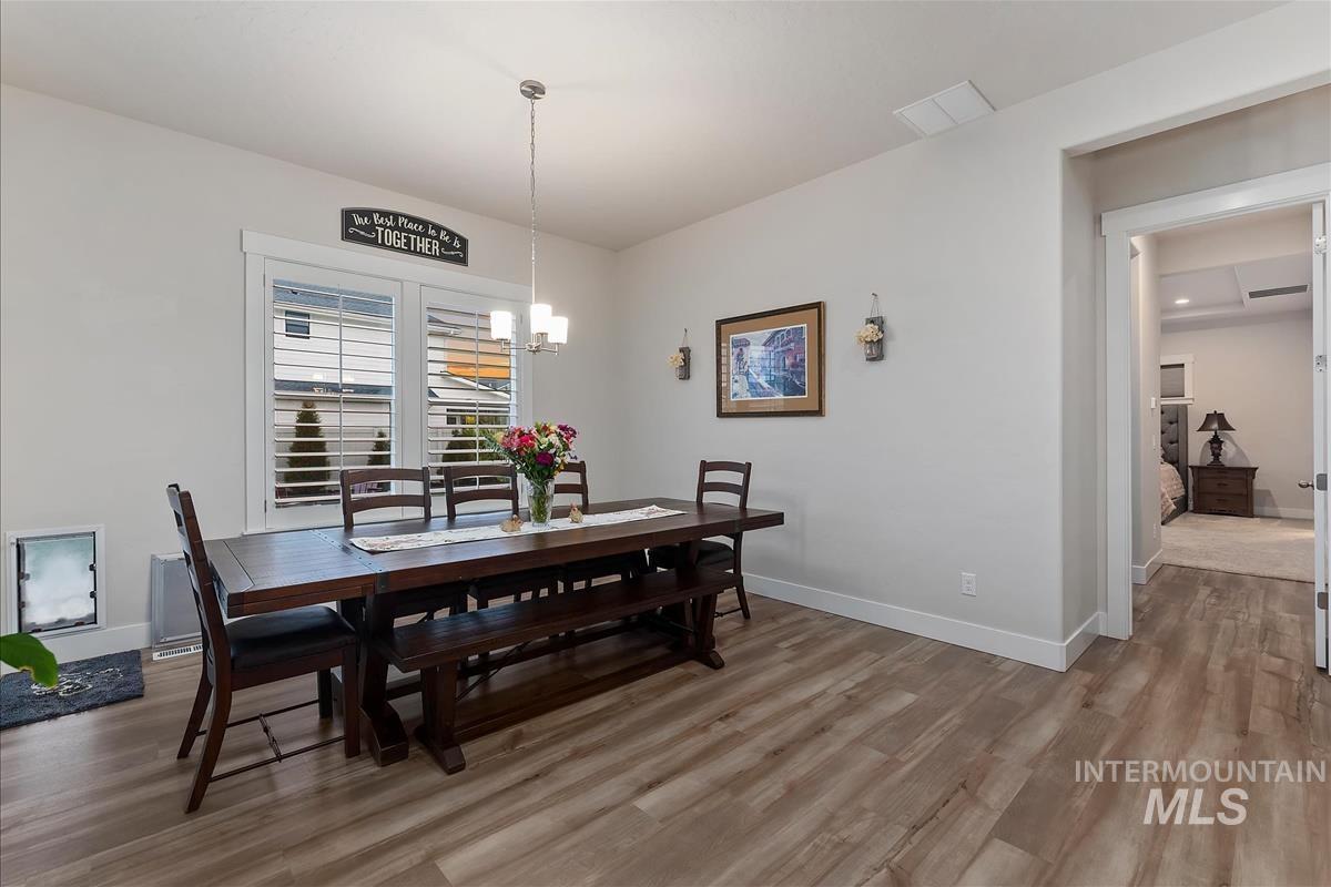 3413 North Hosta Avenue Star, ID 83669 - Photo 10 of 50 Dining space with light wood-style floors and suspended lighting