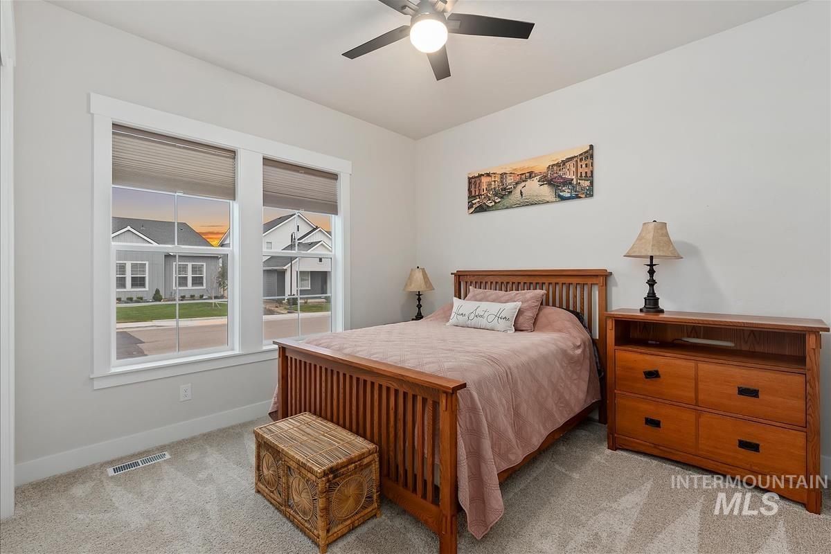 3413 North Hosta Avenue Star, ID 83669 - Photo 21 of 50 Bedroom featuring light colored carpet and ceiling fan