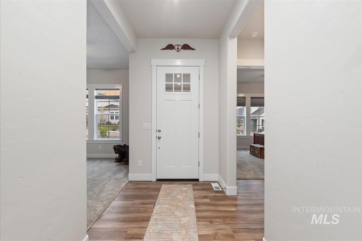 3413 North Hosta Avenue Star, ID 83669 - Photo 24 of 50 Foyer entrance with light wood-style flooring and light carpet