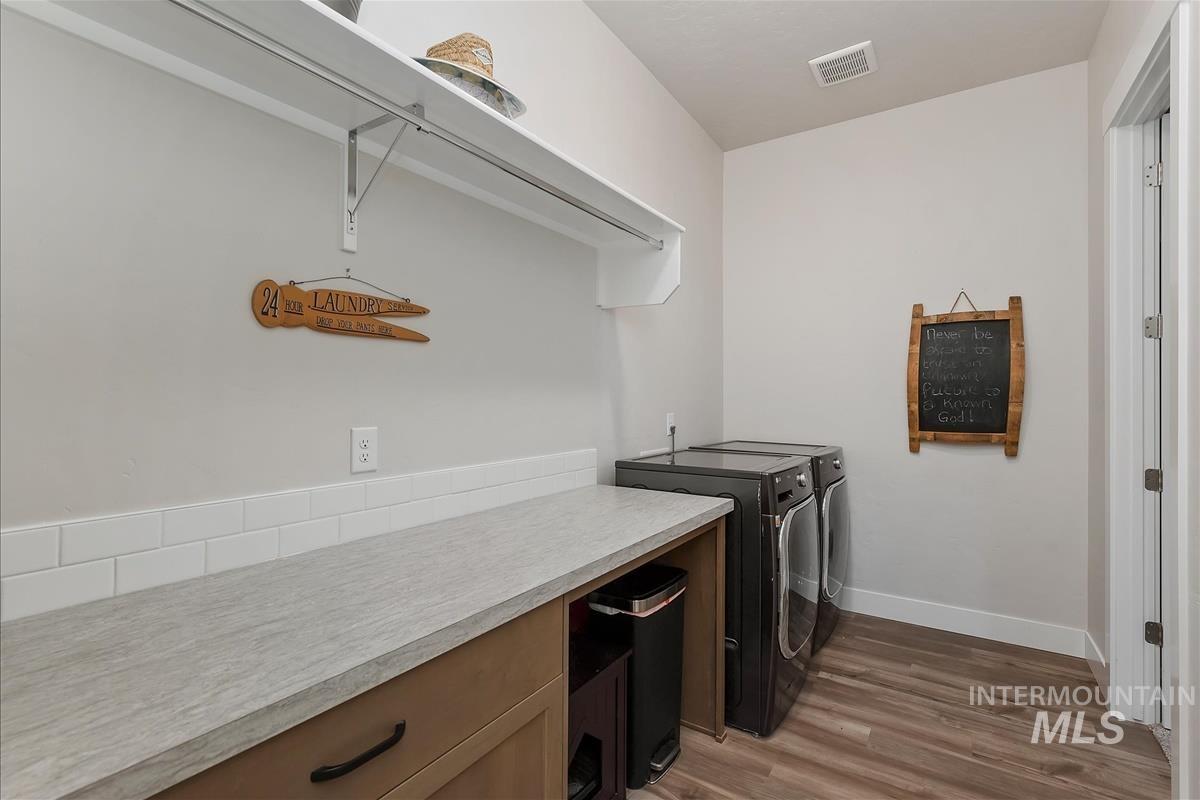 3413 North Hosta Avenue Star, ID 83669 - Photo 27 of 50 Laundry room featuring light wood-type flooring and independent washer and dryer