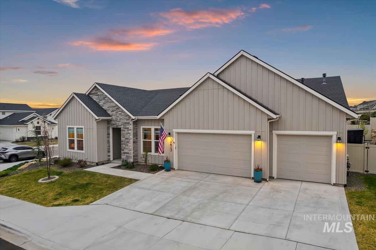 3413 North Hosta Avenue Star, ID 83669 - Photo 38 of 50 View of front facade with an attached garage, driveway, and roof with shingles
