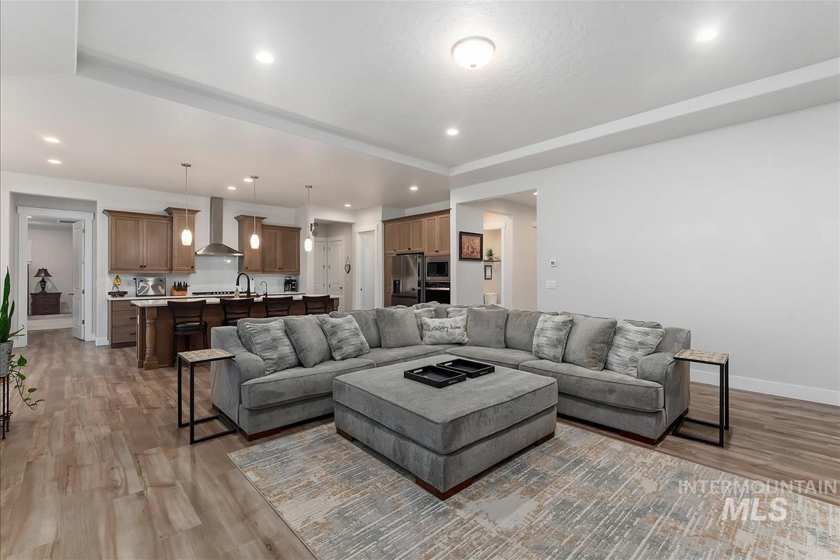 3413 North Hosta Avenue Star, ID 83669 - Photo 6 of 50 Living room featuring light wood-style floors and recessed lighting