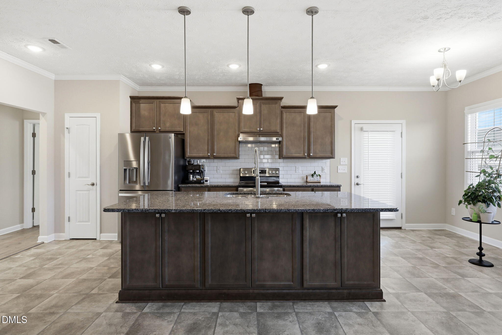 3017 Branscombe Road Fayetteville, NC 28304 - Photo 5 of 43 a kitchen with stainless steel appliances kitchen island granite countertop a refrigerator a sink and dishwasher