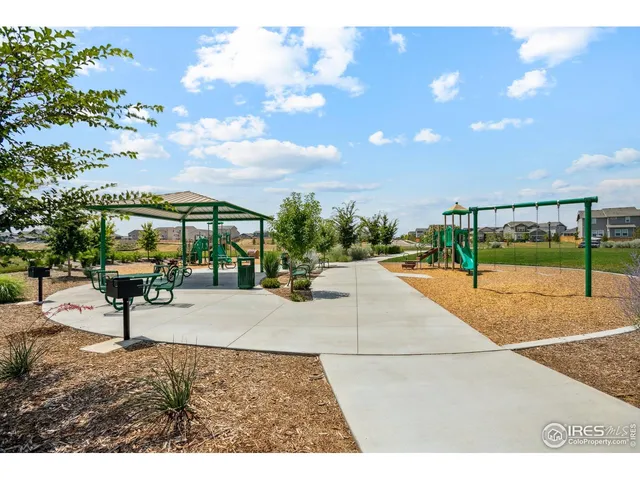 a view of outdoor space with playground and green space