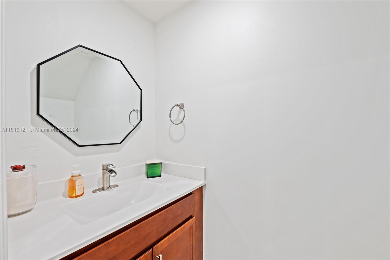 9361 West 33rd Way Hialeah, FL 33018 - Photo 15 of 30 a bathroom with a sink and a mirror
