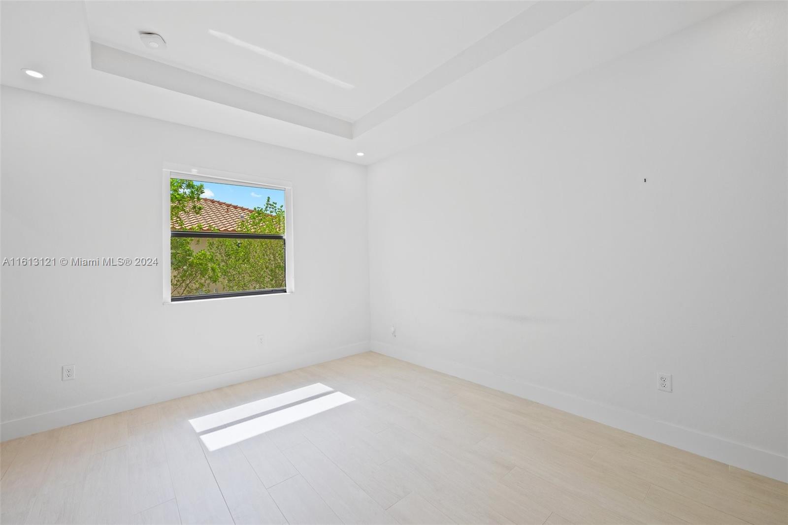 9361 West 33rd Way Hialeah, FL 33018 - Photo 16 of 30 an empty room with windows