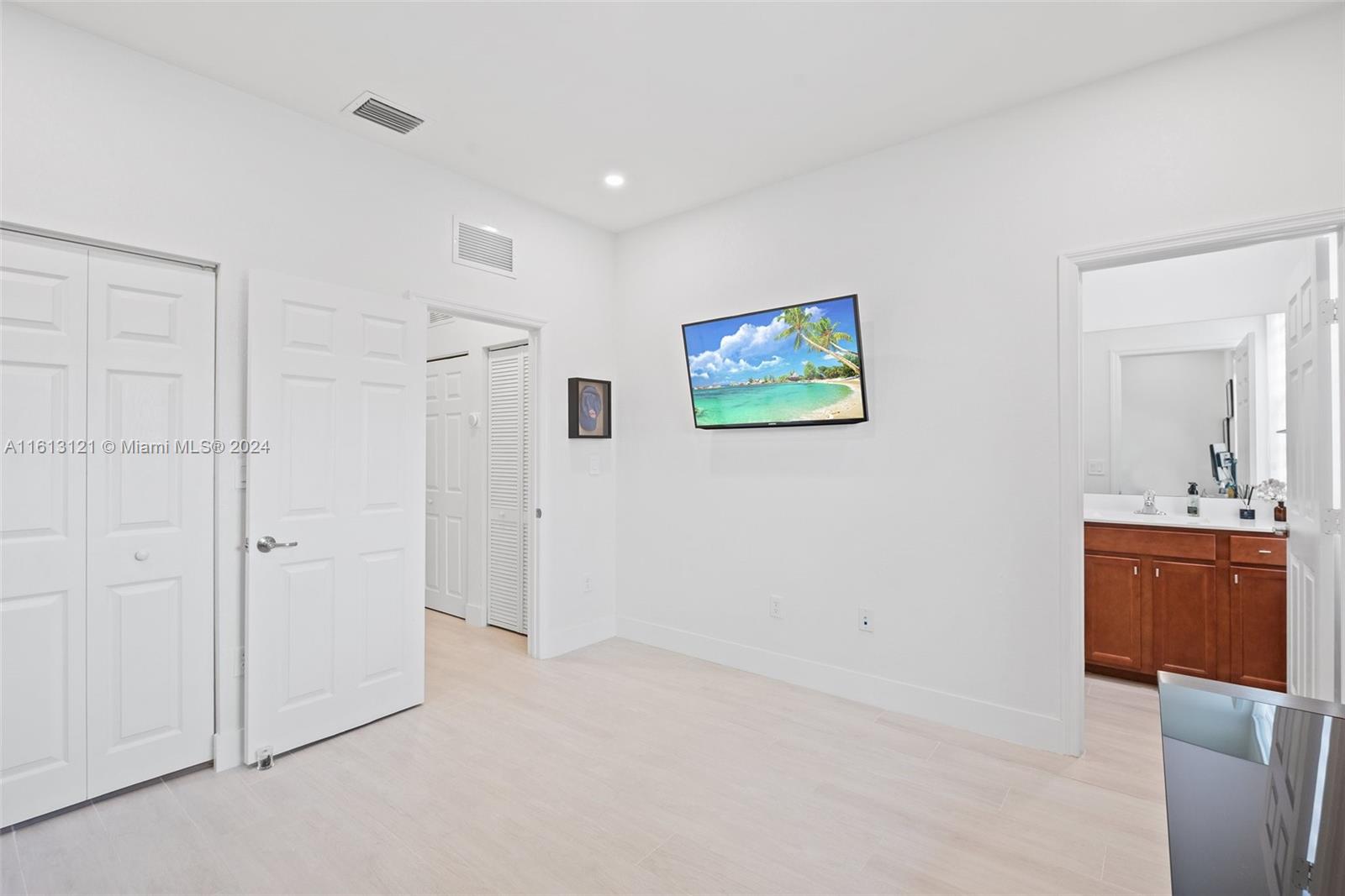 9361 West 33rd Way Hialeah, FL 33018 - Photo 21 of 30 a view of a hallway with a kitchen