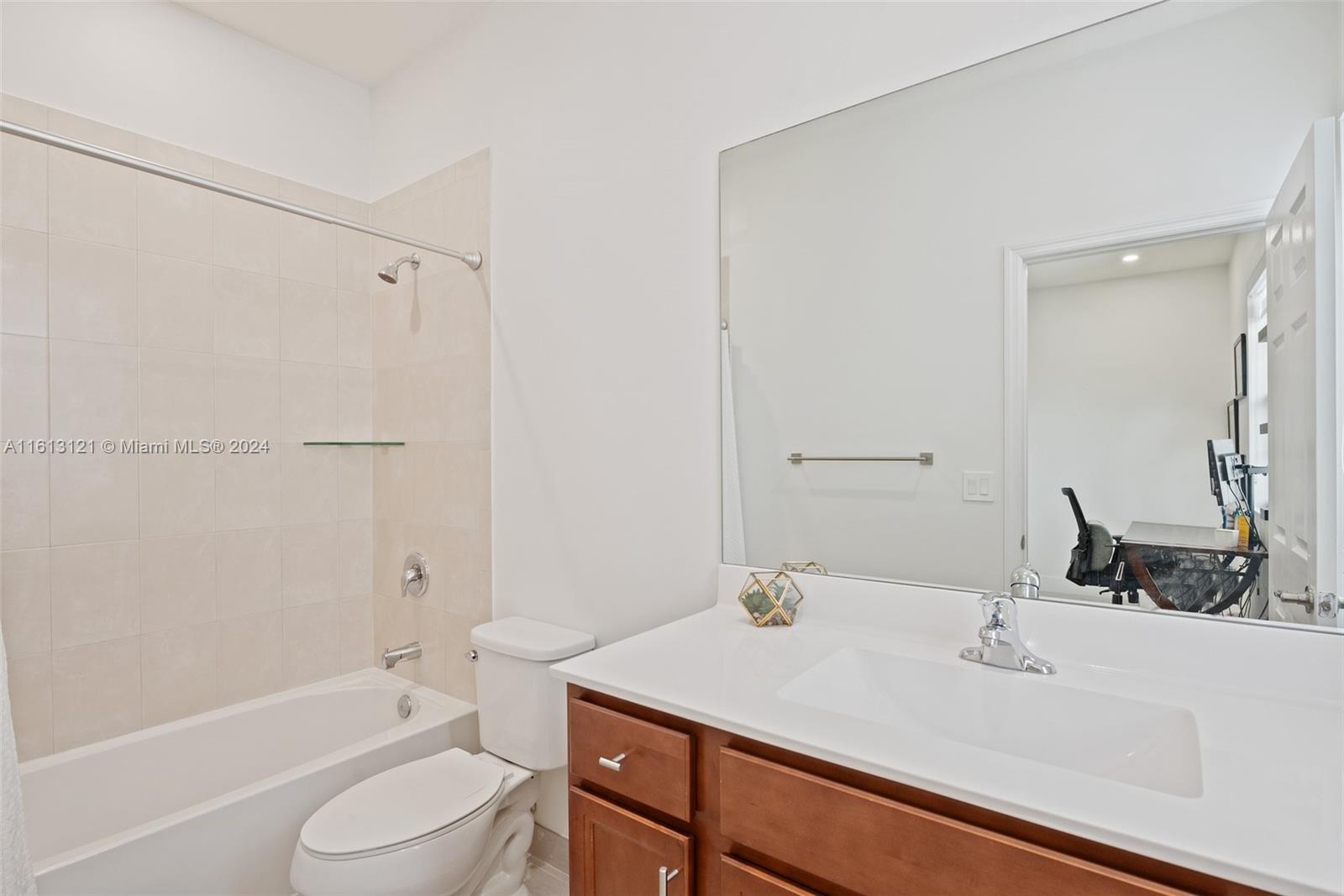 9361 West 33rd Way Hialeah, FL 33018 - Photo 22 of 30 a bathroom with a sink toilet vanity and shower
