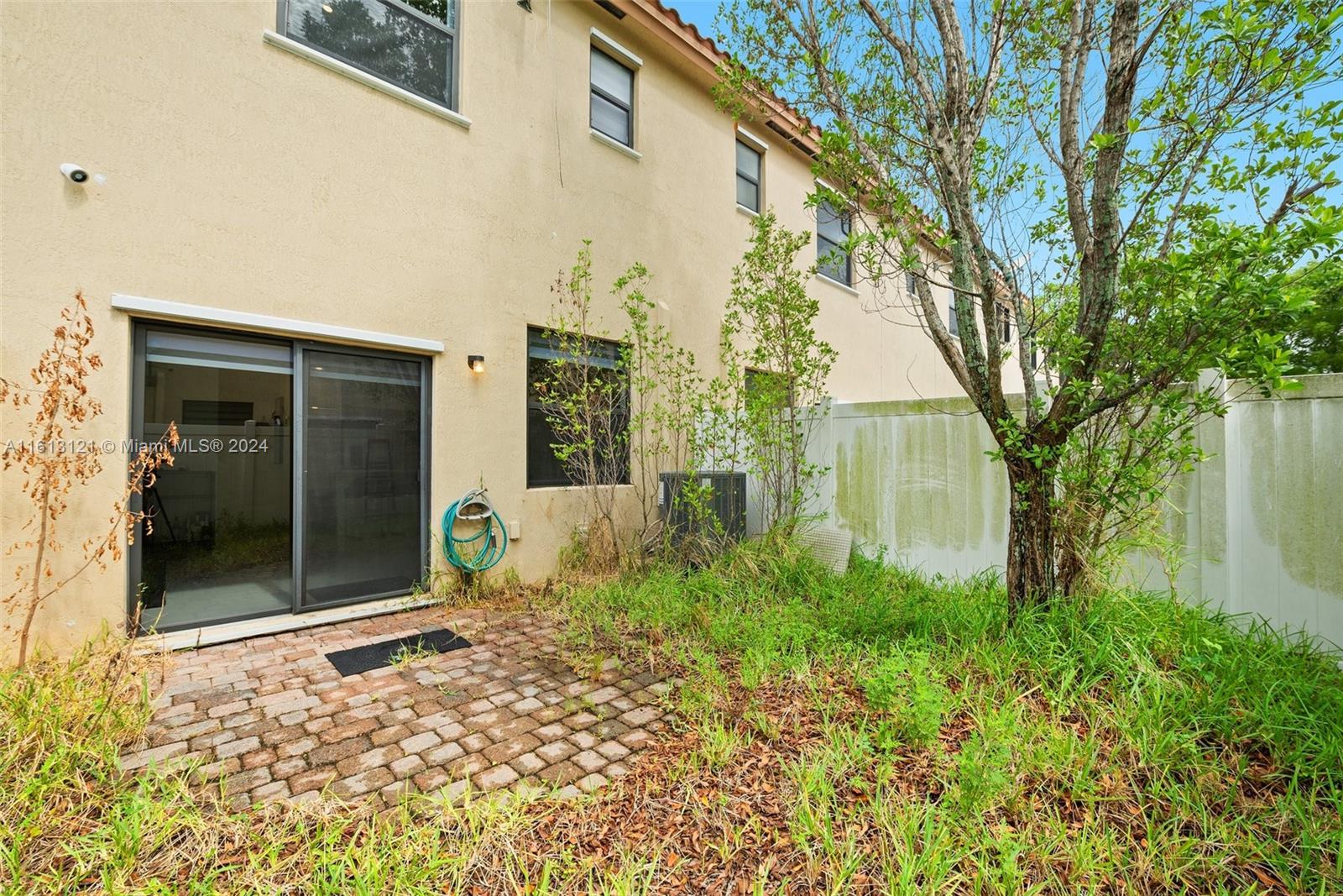 9361 West 33rd Way Hialeah, FL 33018 - Photo 25 of 30 front view of a house with a yard