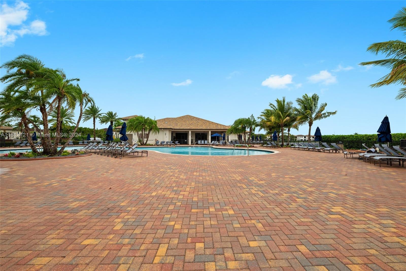 9361 West 33rd Way Hialeah, FL 33018 - Photo 29 of 30 a palm tree sitting in front of a building with palm trees