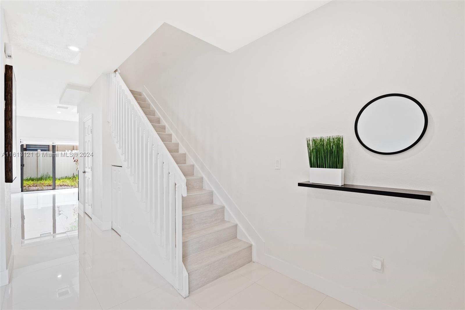9361 West 33rd Way Hialeah, FL 33018 - Photo 5 of 30 a view of entryway and hall with wooden floor