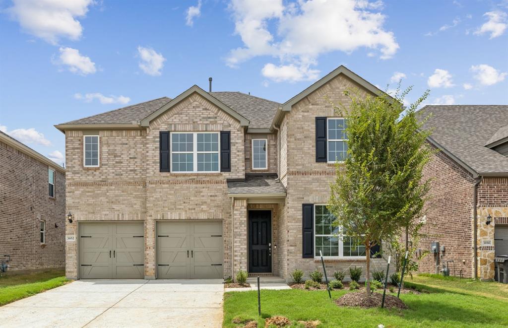 front view of a house with a yard