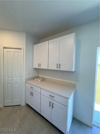 a view of cabinets and utility room