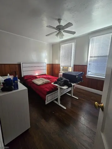 a living room with furniture pool table and a window
