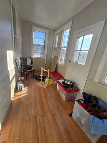 a bedroom with furniture and a wooden floor