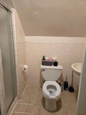 a bathroom with a toilet and a sink