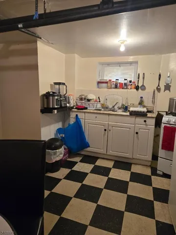 a kitchen with a sink and a stove