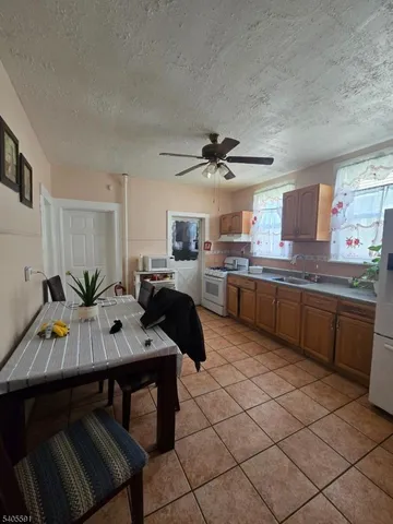 a kitchen with a sink cabinets and window