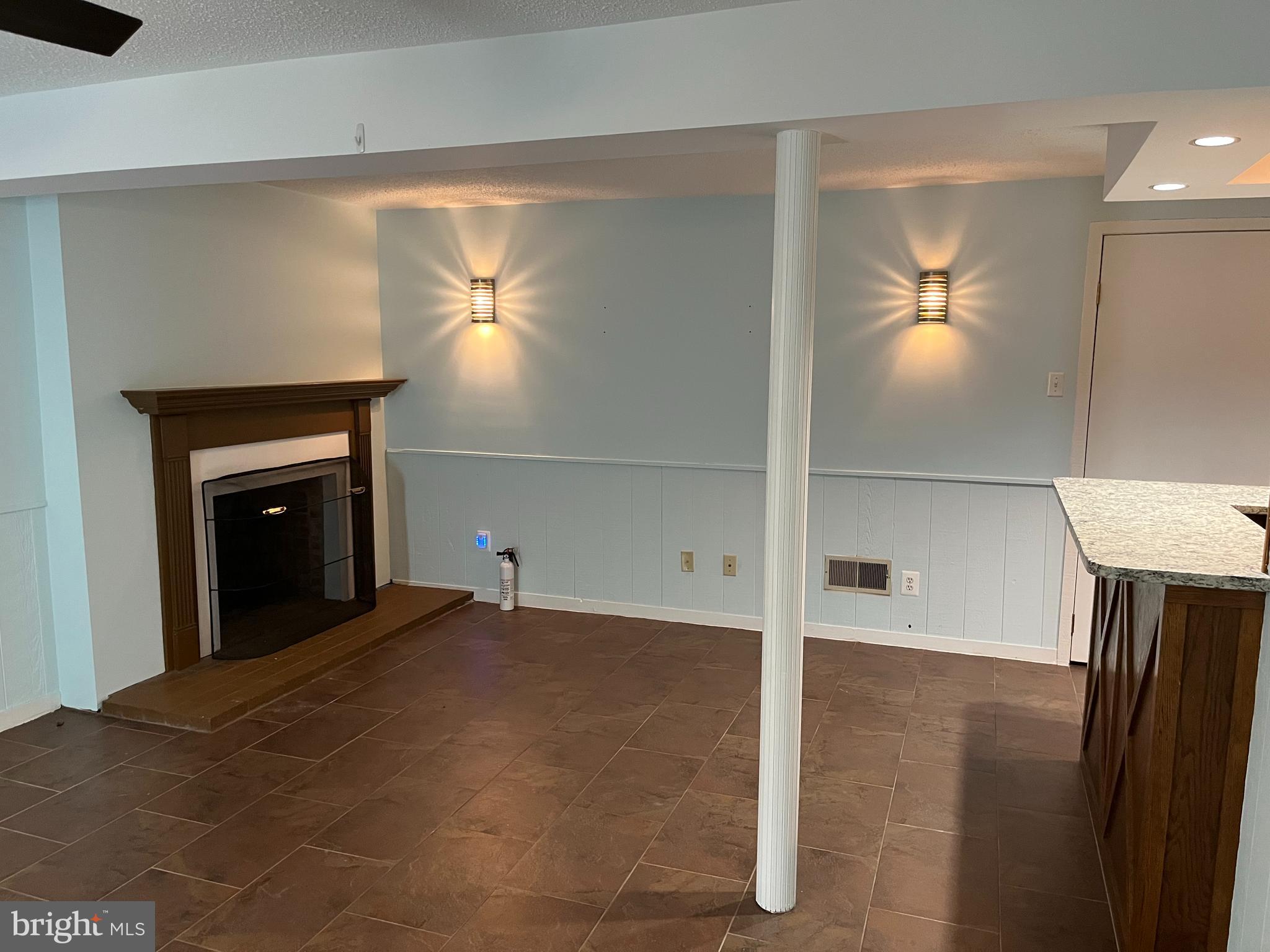 5608 Heming Avenue Springfield, VA 22151 - Photo 14 of 26 a view of an empty room with window and fire place