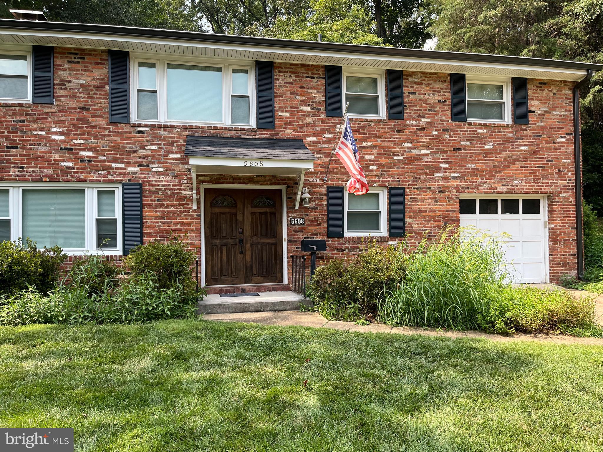 5608 Heming Avenue Springfield, VA 22151 - Photo 2 of 26 a front view of a house with a garden