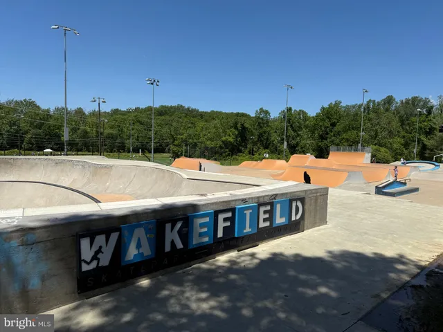 a view of a swimming pool with a yard