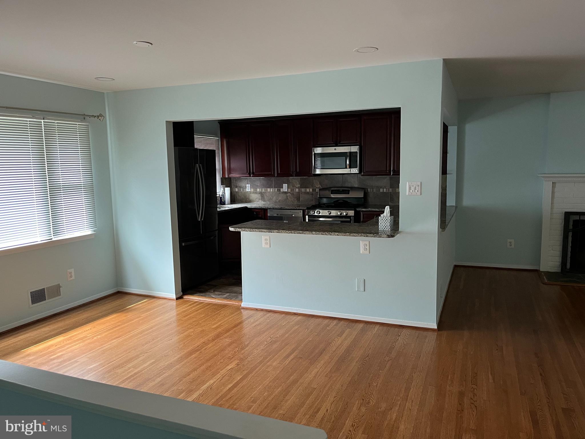 5608 Heming Avenue Springfield, VA 22151 - Photo 5 of 26 a kitchen with stainless steel appliances a refrigerator sink and microwave