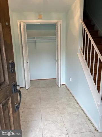 a view of an empty room with stairs